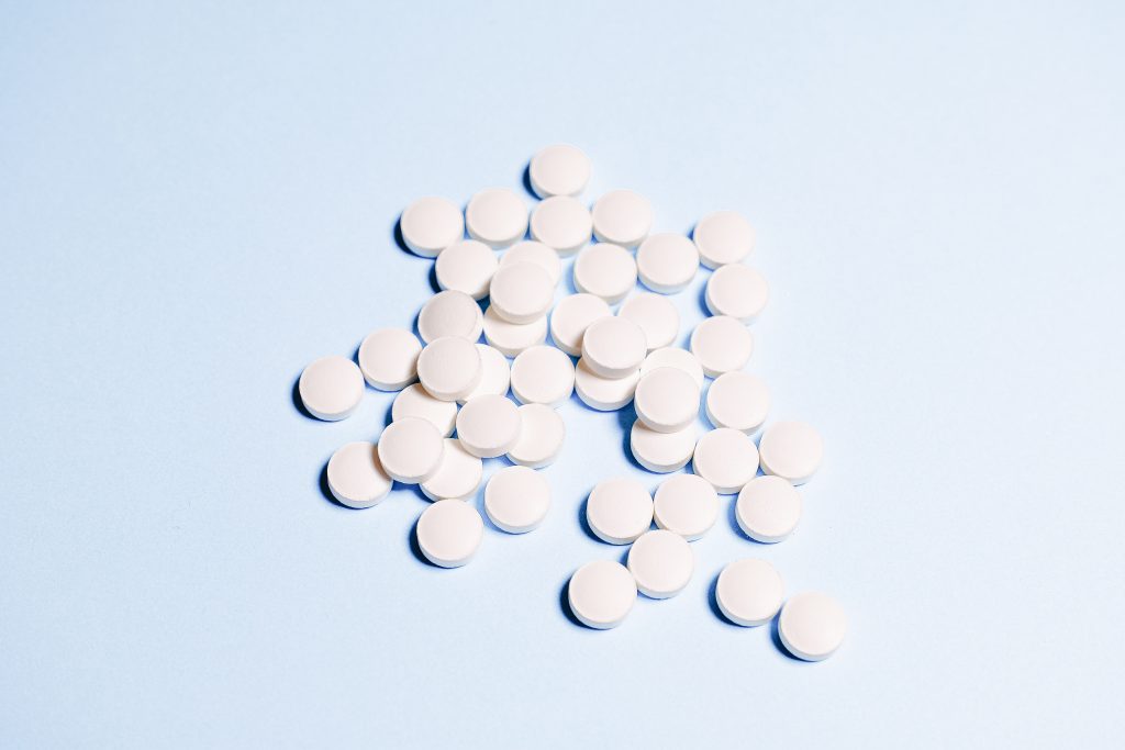 Pills on display on a blue background